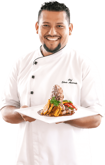 The Guava Limb Cafe Restaurant Belize chef edwin portrait holding food plate